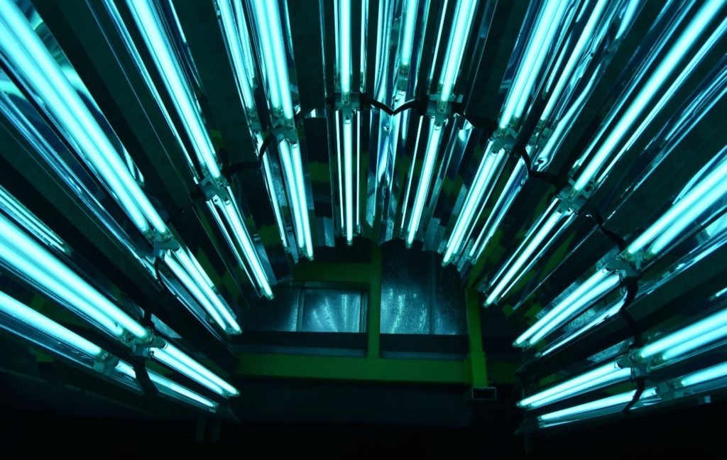 Interior of a reflectorized hemicylindrical array of germicidal UV-C lamps.